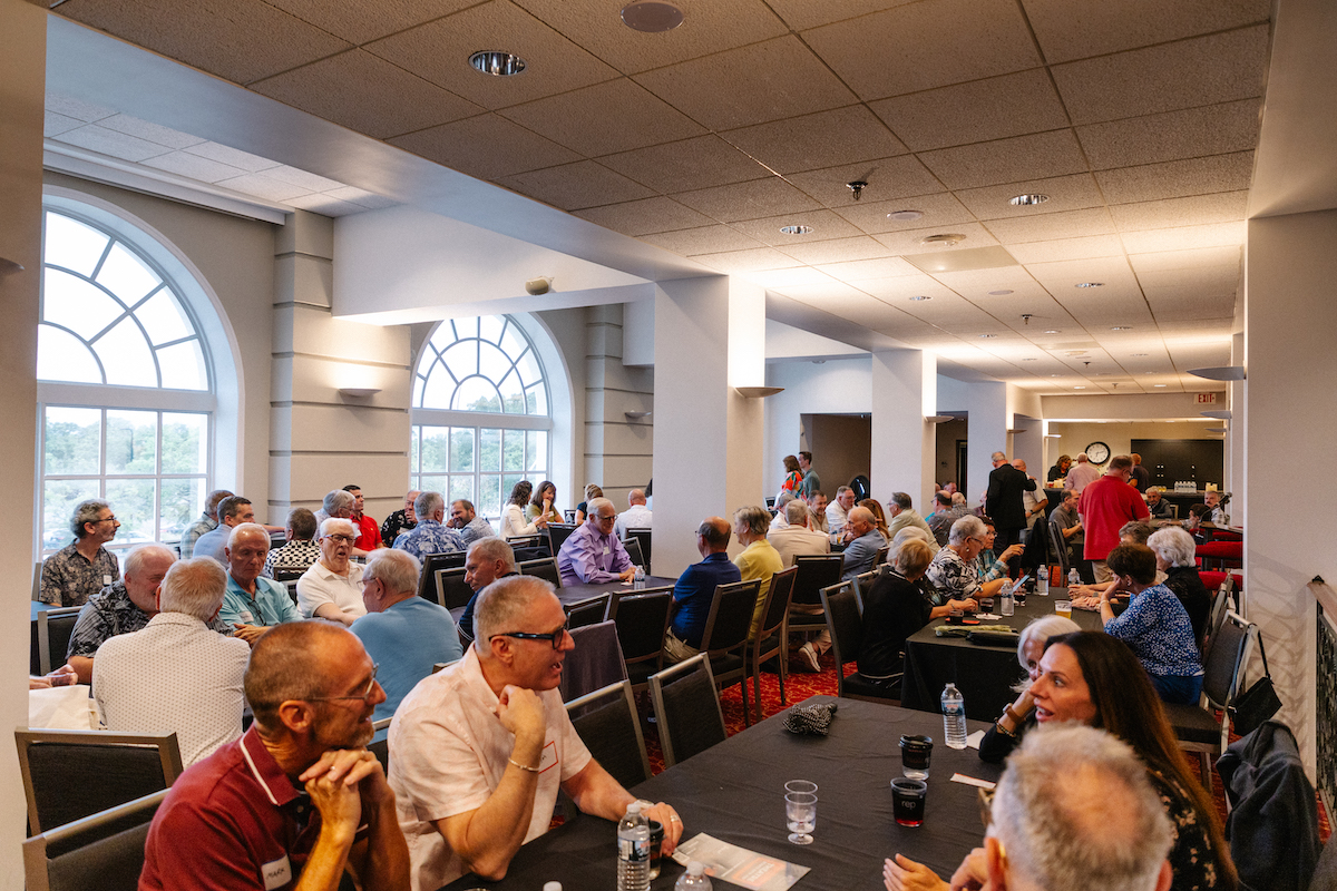 group of people sitting at a table at an event
