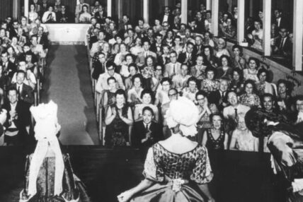Historic photo shot from behind actors on the Asolo Rep stage with the audience in the background