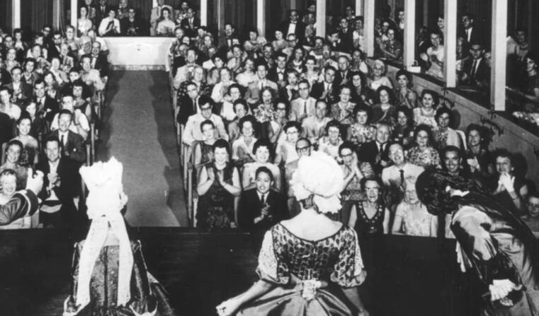 Historic photo shot from behind actors on the Asolo Rep stage with the audience in the background