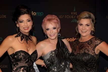 Three women dressed in black-tie attire posing for a photo as Asolo Rep's 2019 Annual Gala.