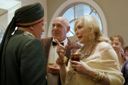 Two men and a woman in deep conversation at Asolo Rep's 2020 Annual Gala.