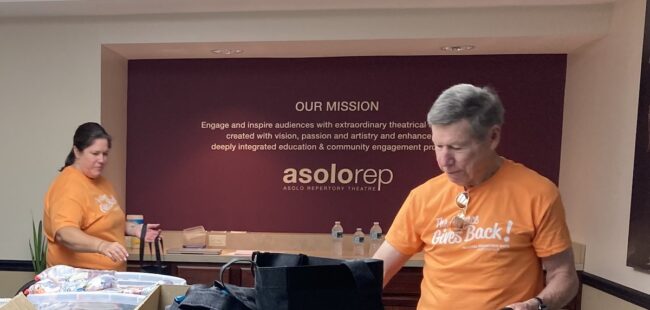 Asolo volunteers stuffing gift bags for patrons