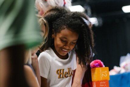 A young girl completing an activity at an Asolo Rep youth program.